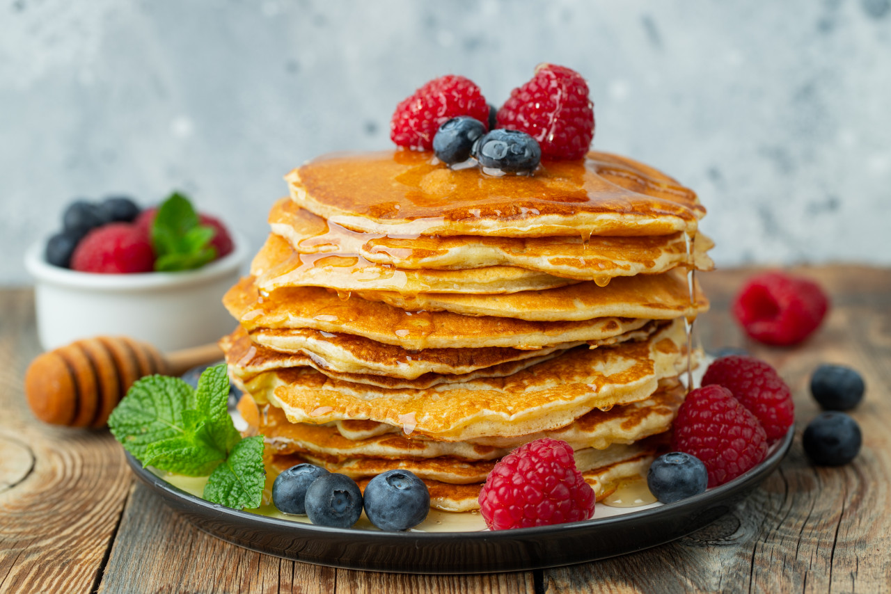 delicious pancakes with fresh berries honey