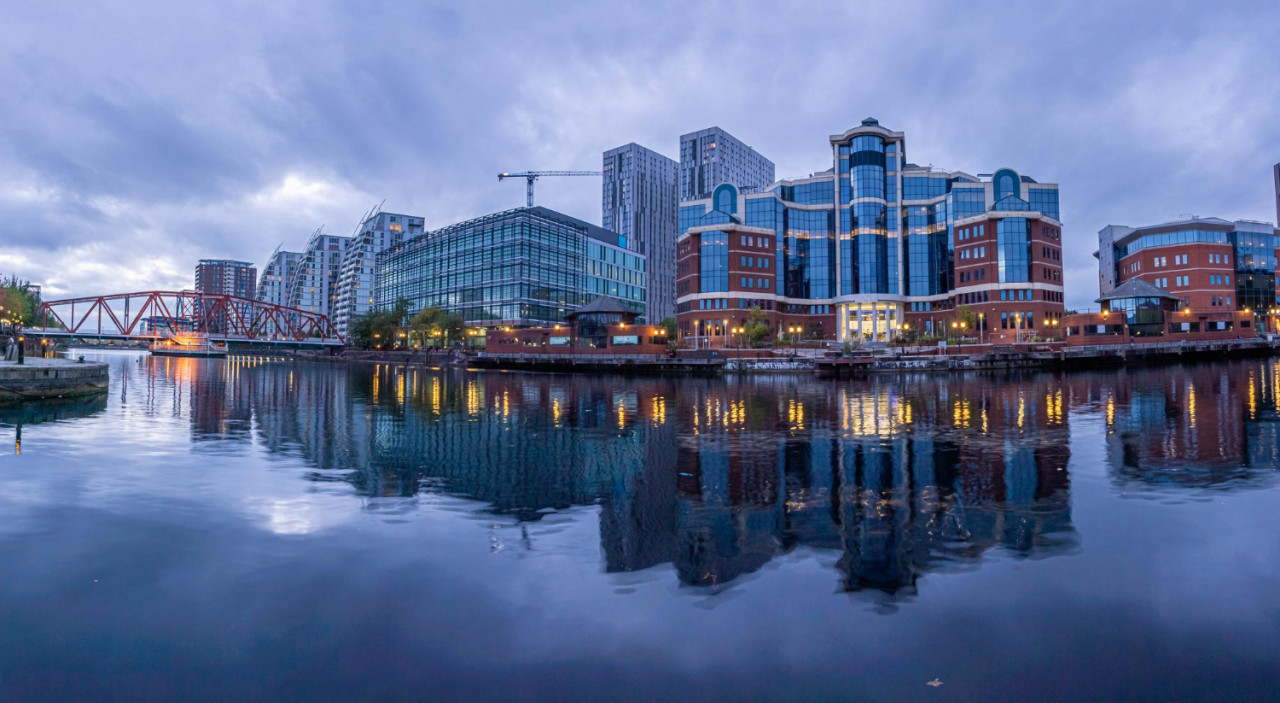 dusk view castlefield inner city conservation area manchester north west england it is bounded by river irwell quay street deansgate chester road