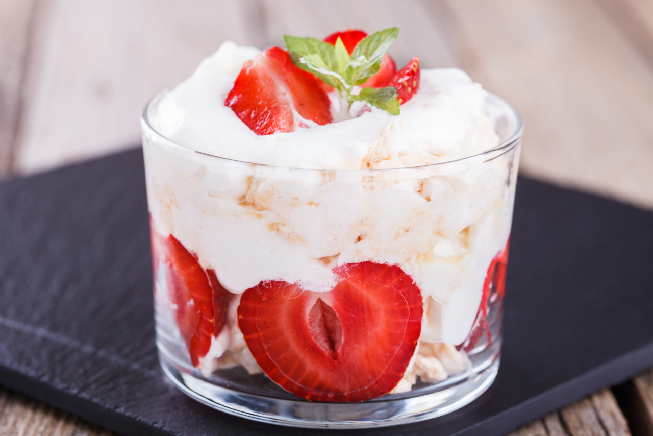 eton mess strawberries with whipped cream meringue glass beaker