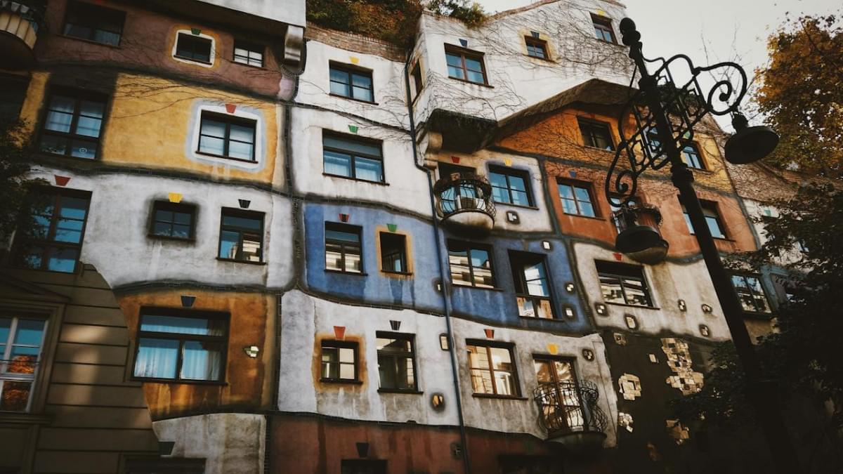 facade of creative colorful apartment house in autumn city