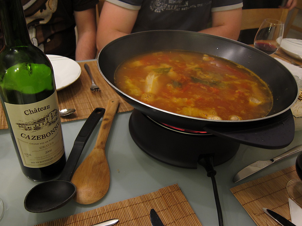 chinese hot pot also known as soupfood steamboat is cooking method that originates from china prepared with simmering pot soup stock dining table