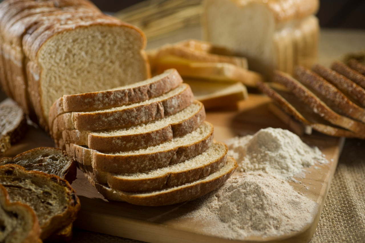 fresh irish soda bread with oat sliced slate cutting board