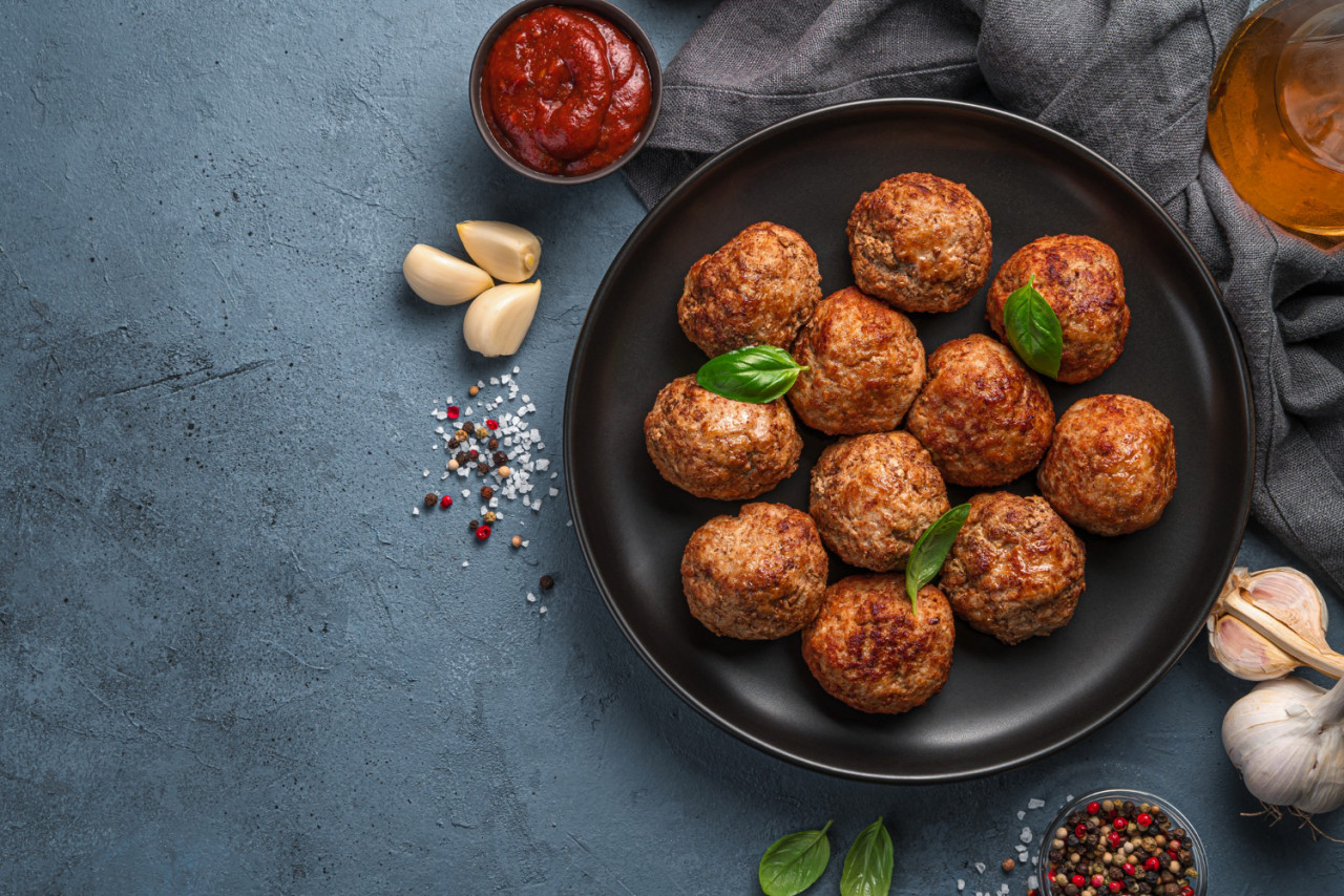 fried meatballs with basil dark background with tomato sauce garlic top view copy space