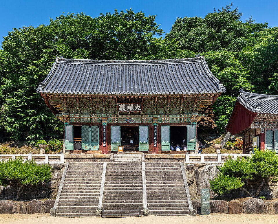 front exterior view of beomeosa temple with three stairs and blue sky in busan south korea