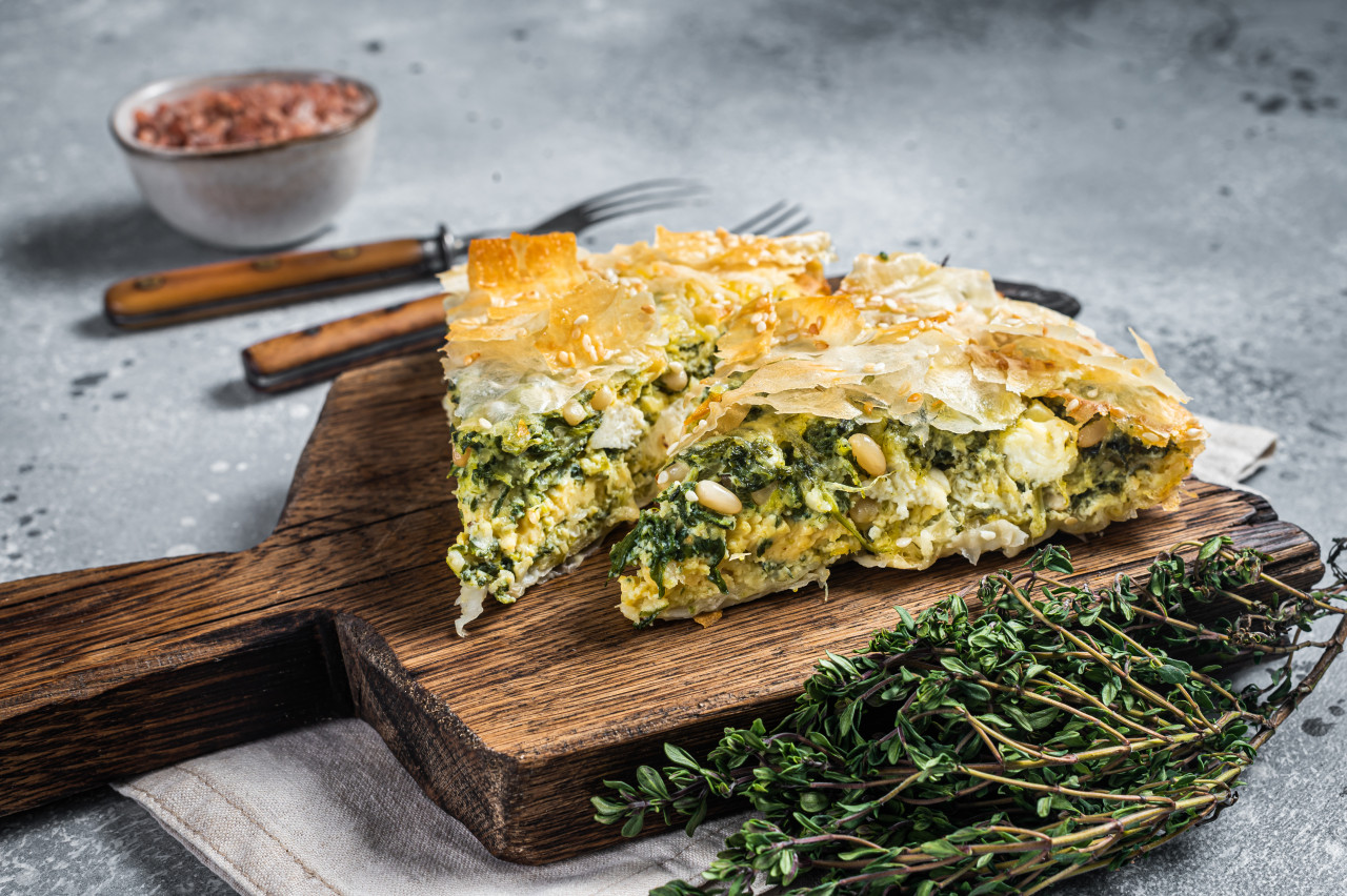 greek pie spanakopita with spinach cheese wooden board gray background top view