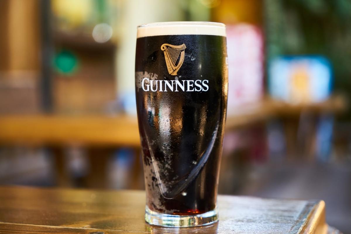 guinness glass filled with beer