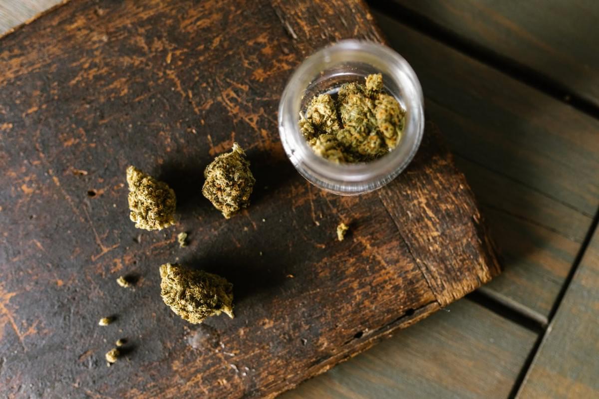 high angle shot of marijuana on wooden surface 1