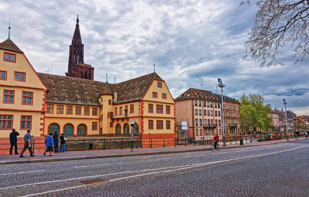 historical museum cathedral notre dame waterfront ill river pont du corbeau bridge old town strasbourg france people background