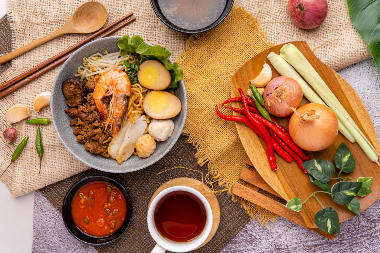 hokkien mee are tossed in pork lard and served with fish balls shrimp