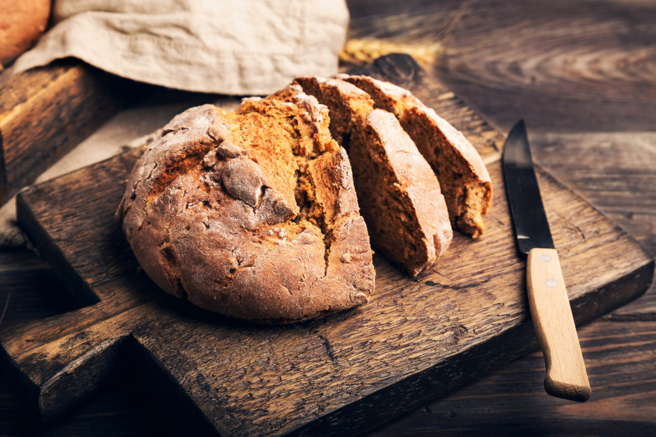 homemade rustic rye bread with coriander seeds wooden cutting board