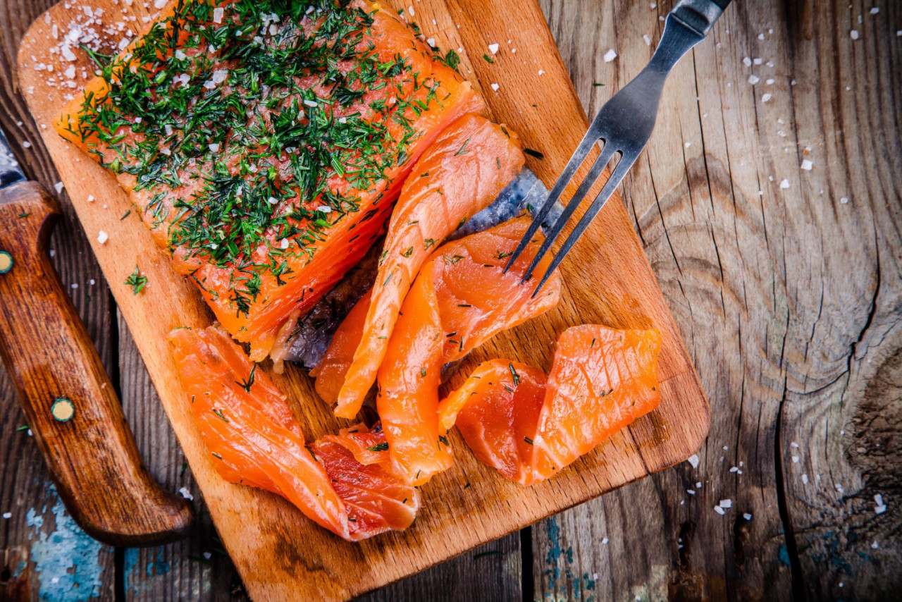 homemade smoked salmon with dill wooden table