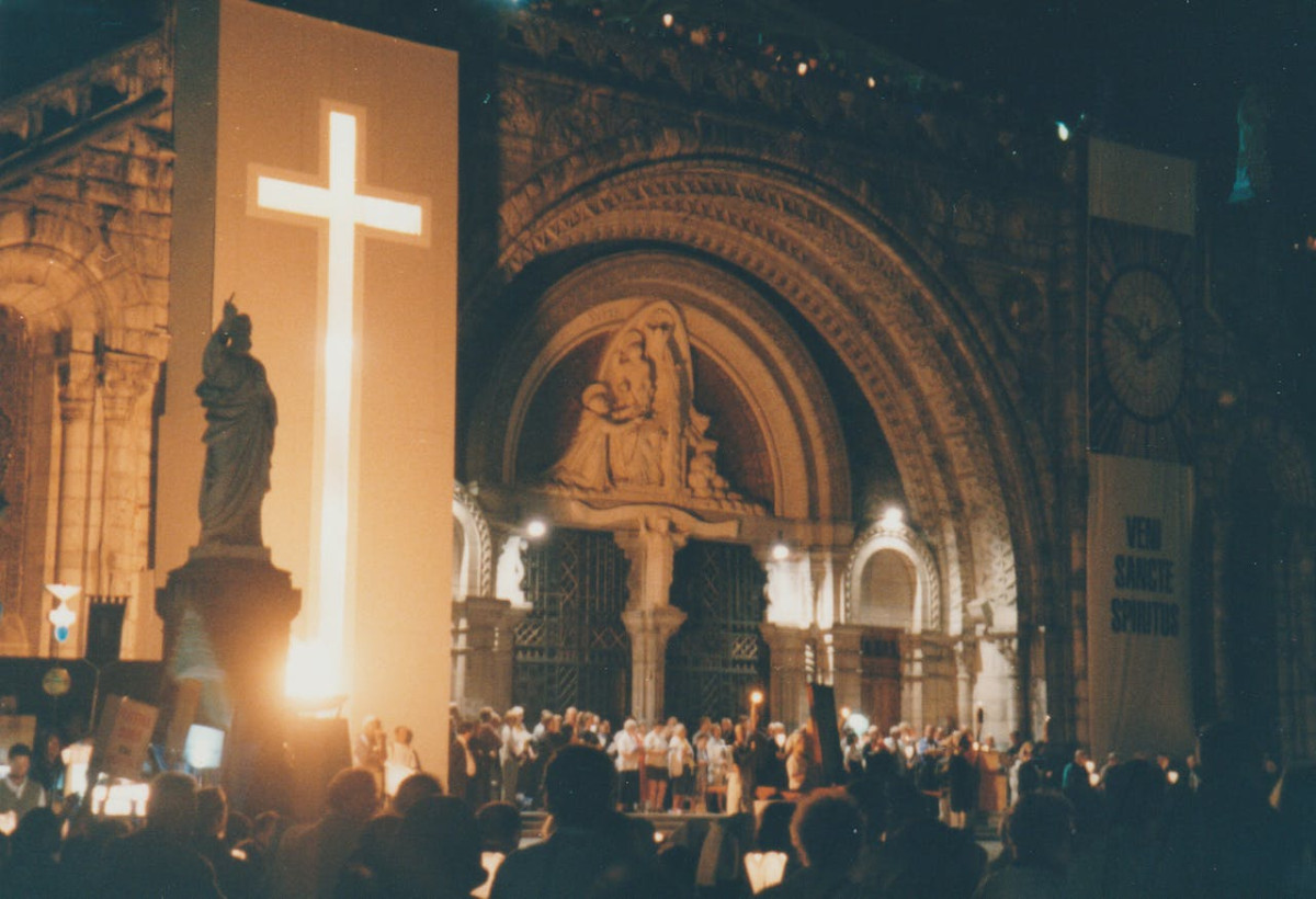 illuminated night gathering at lourdes basilica 1