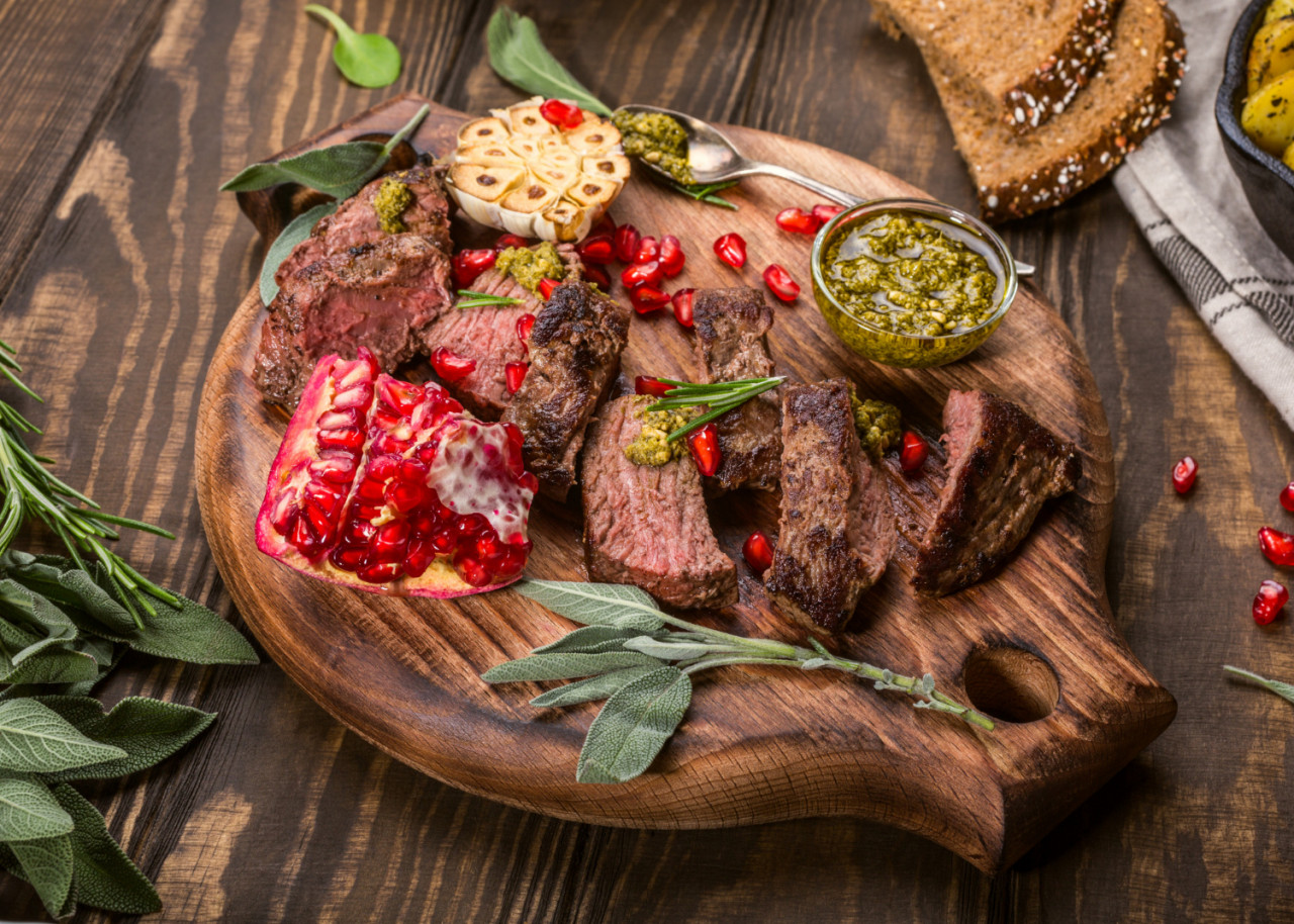 kangaroo meat steak with green pesto pomegranate