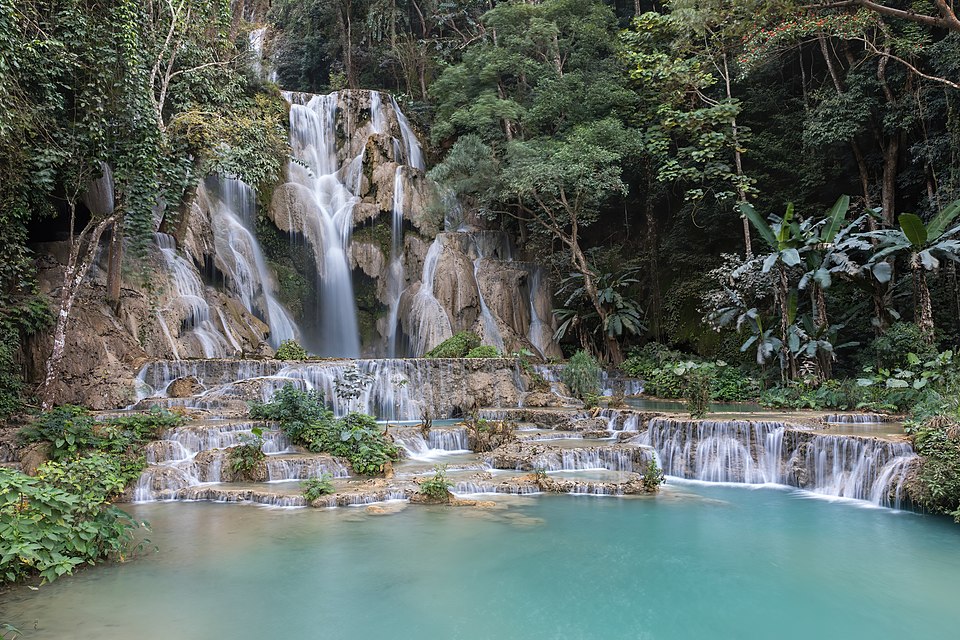 kuang si falls and a turquoise water pool in luang prabang province laos