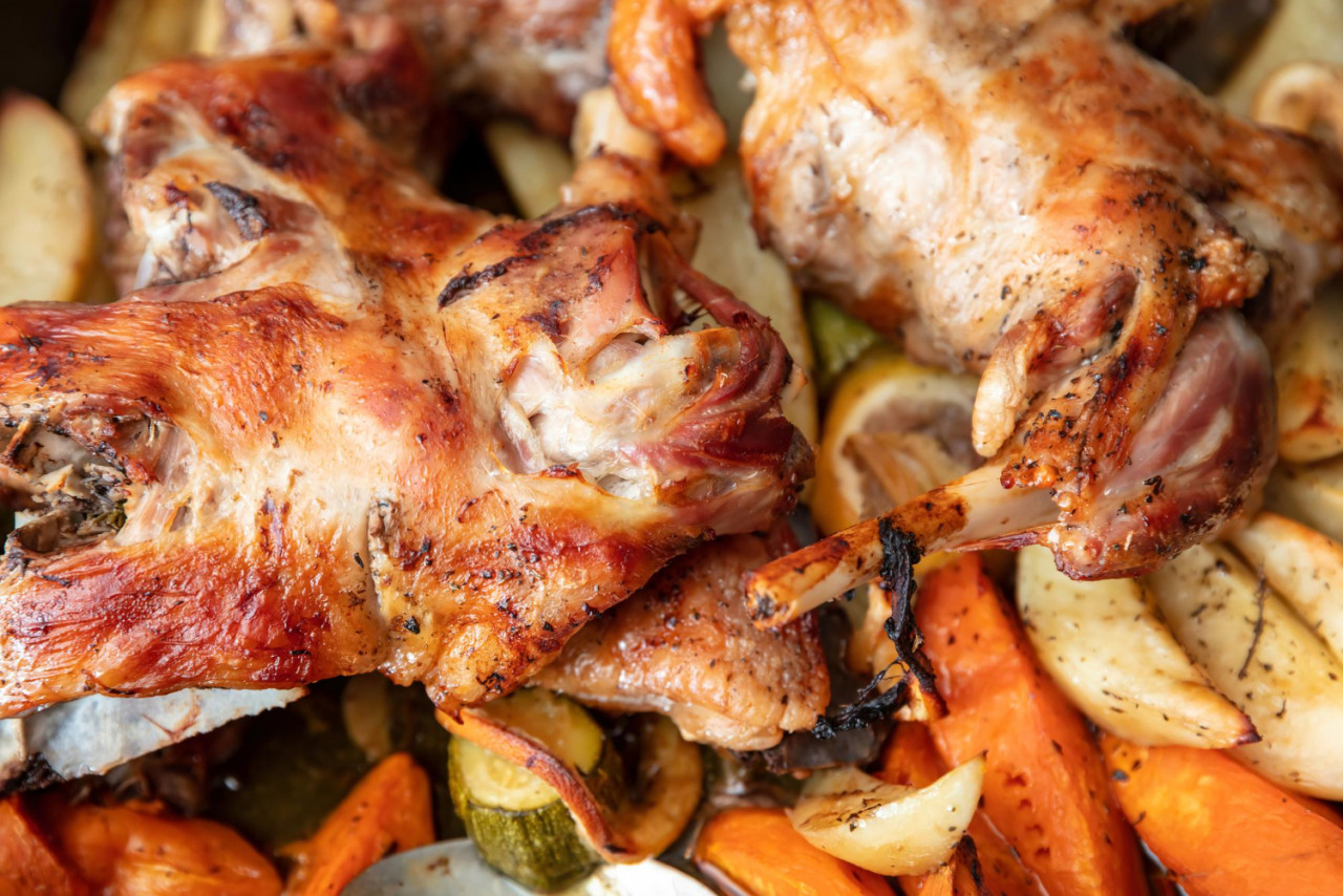 lamb leg with bone baked with potato herb oven traditional greek easter food close up view