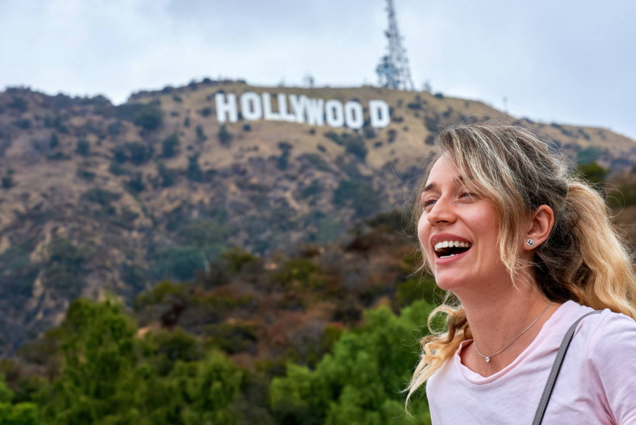 laughing woman hollywood sign los angeles usa