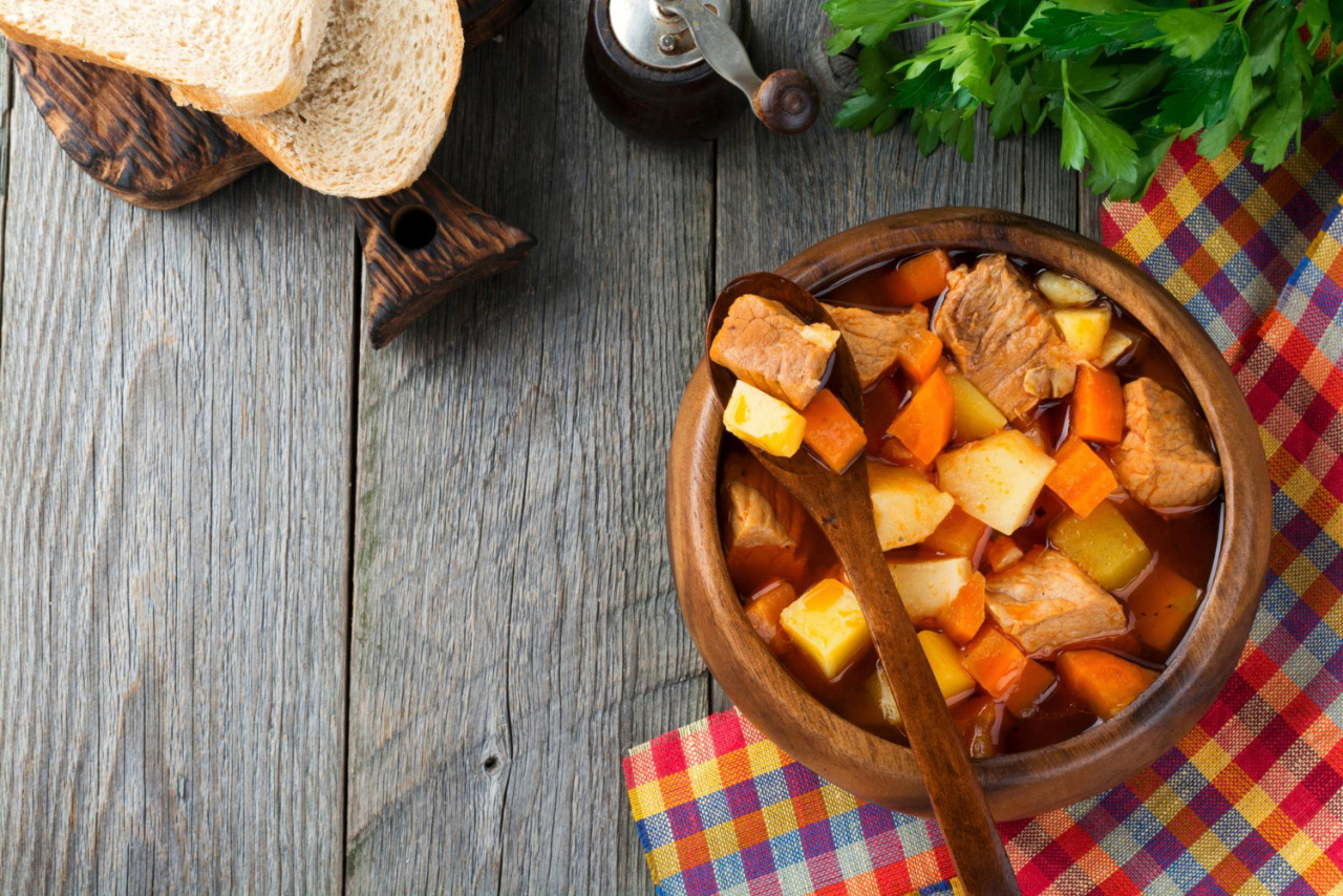 meat soup estofado with potatoes carrots seasonings traditional mexican dishes selective focus top view