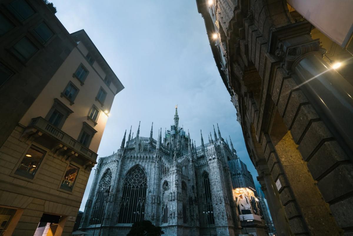 milan cathedral and city street in evening 1