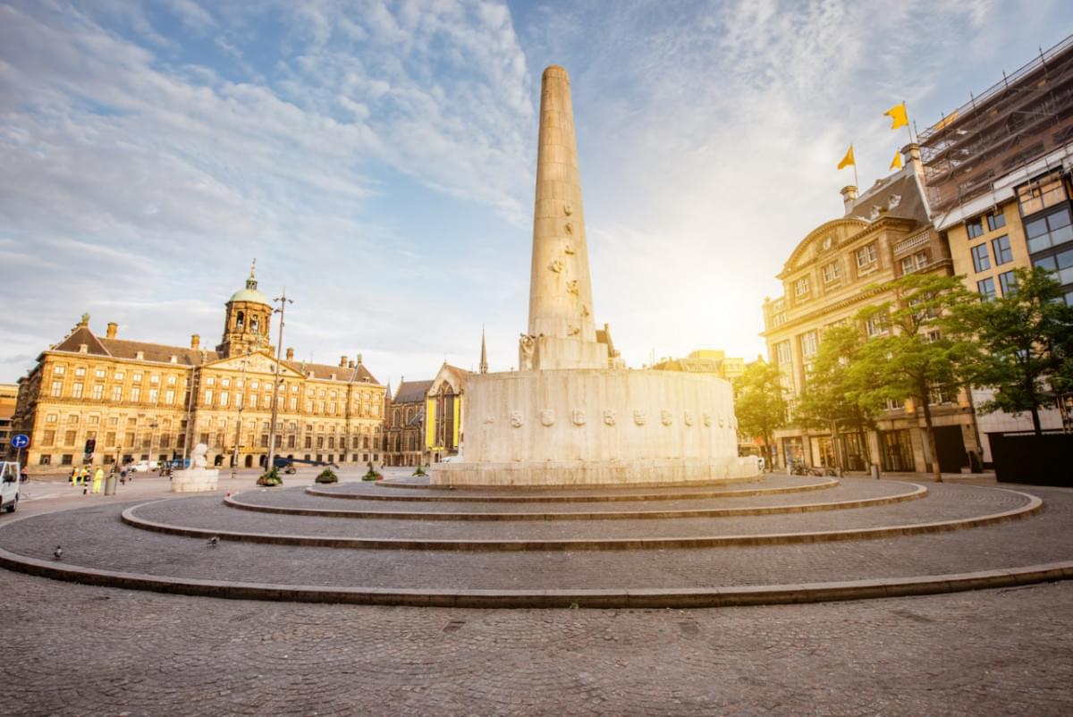 morning view dam square with royal palace monument amsterdam city during sunny weather 1