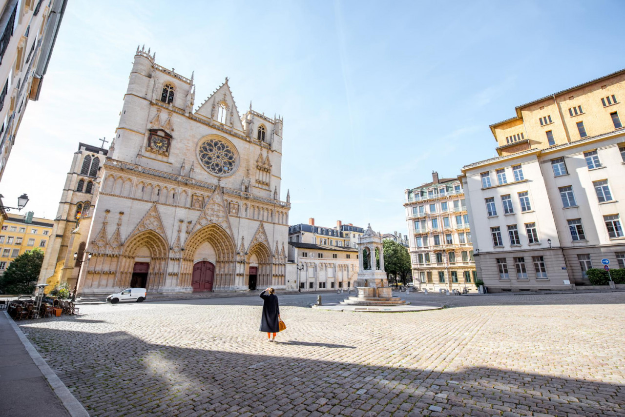 morning view saint john cathedral with woman walking square old town lyon city