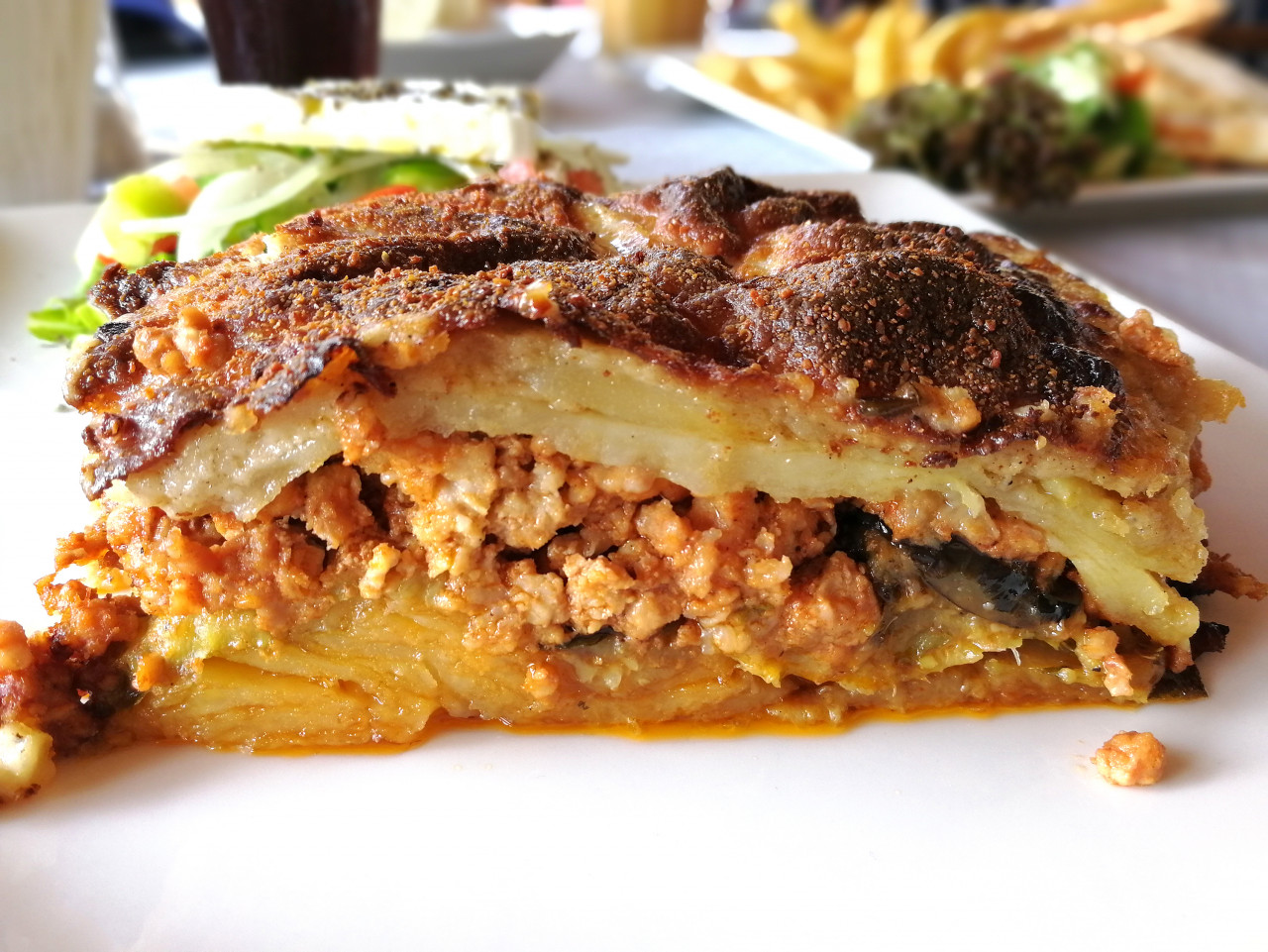 moussaka close up side view traditional greek dish baked layers eggplant meat potatoes bechamel sauce