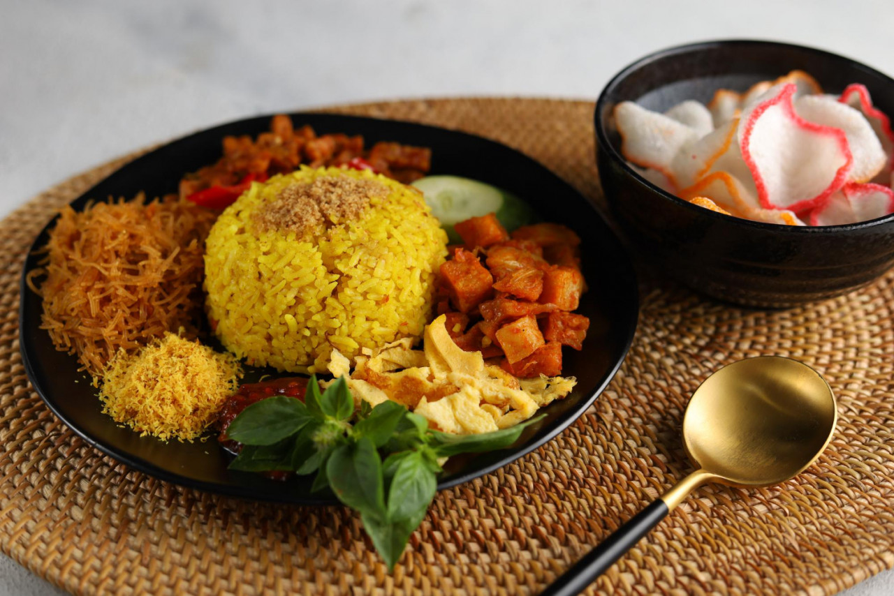 nasi kuning or yellow rice is a traditional menu from indonesia