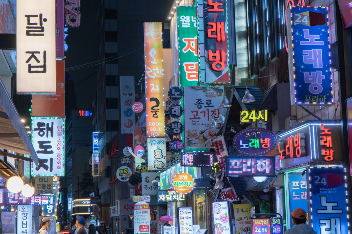 neon signs of seoul myeongdong shopping street at night