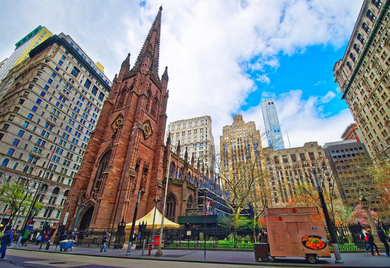 new york usa april 24 2015 street view trinity church lower manhattan new york usa it is historic parish church near wall street broadway tourists nearby