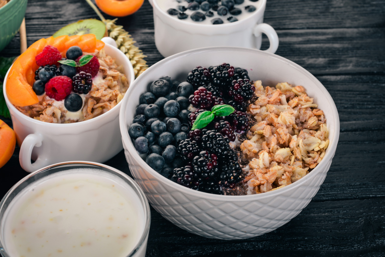 oatmeal with blueberries blackberry wooden background top view free space text