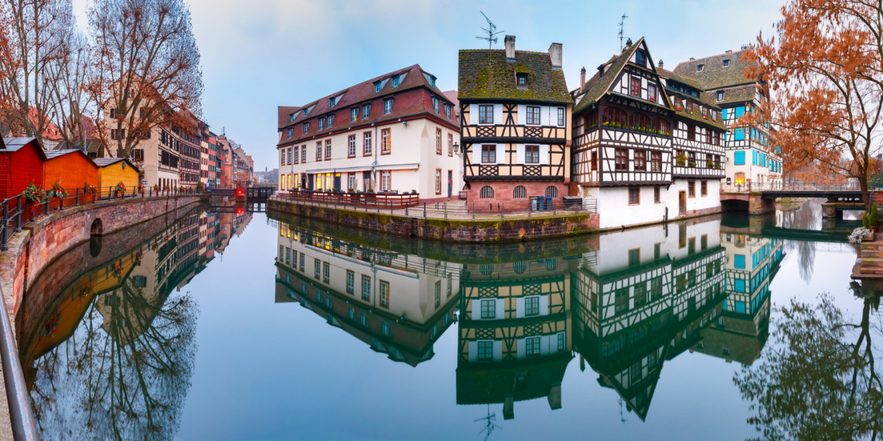 panorama traditional alsatian half timbered houses with mirror reflections petite france morning strasbourg alsace france