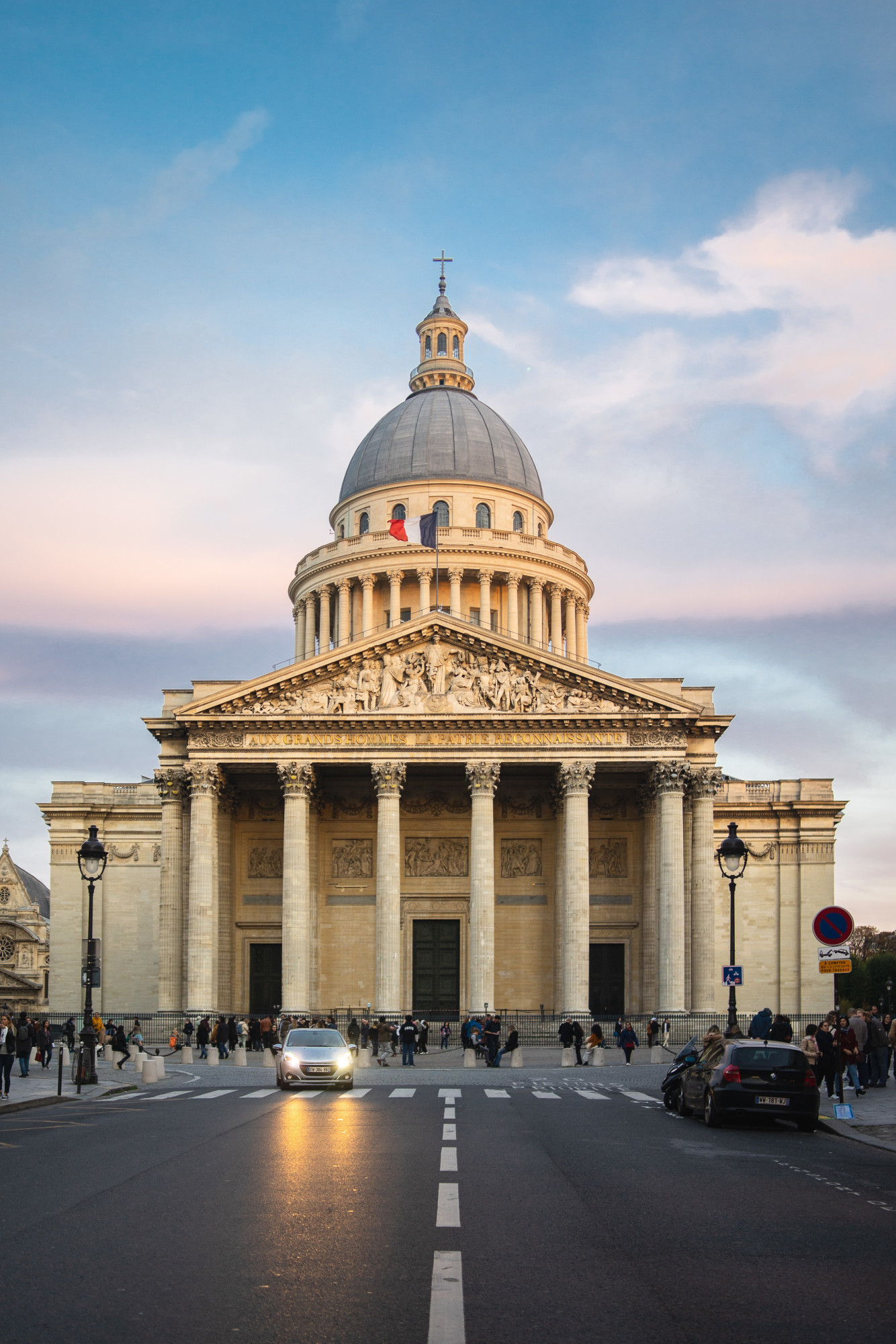 pantheon surrounded by people cloudy sky during sunset paris france