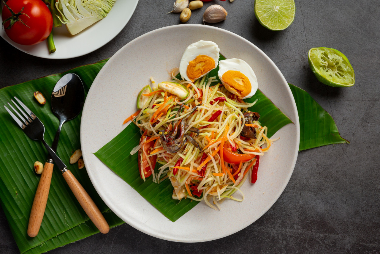 papaya salad served with rice noodles vegetable salad decorated with thai food ingredients