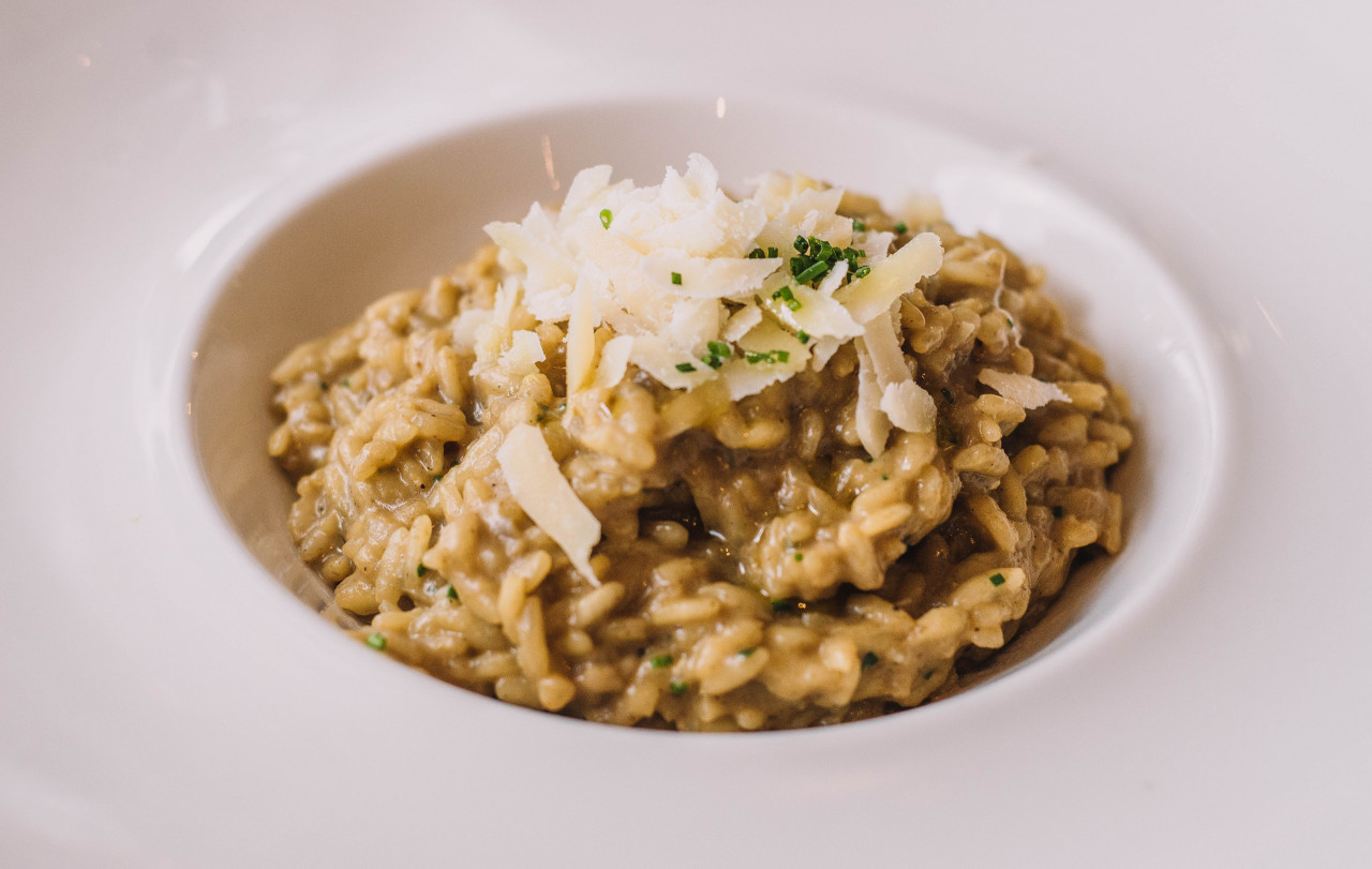 parmesan risotto deep plate seasoned with saffron