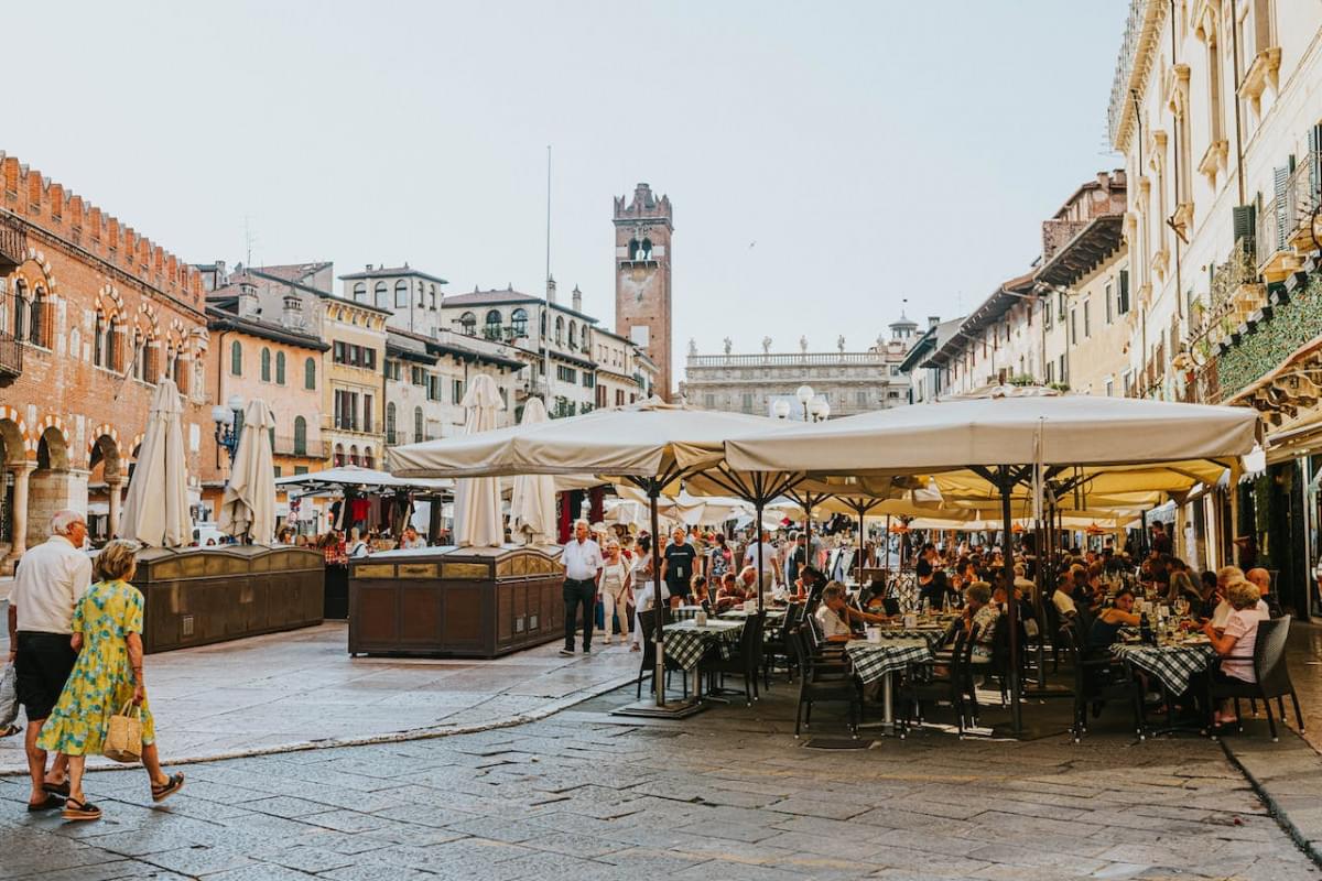 people dining al fresco at piazza delle erbe