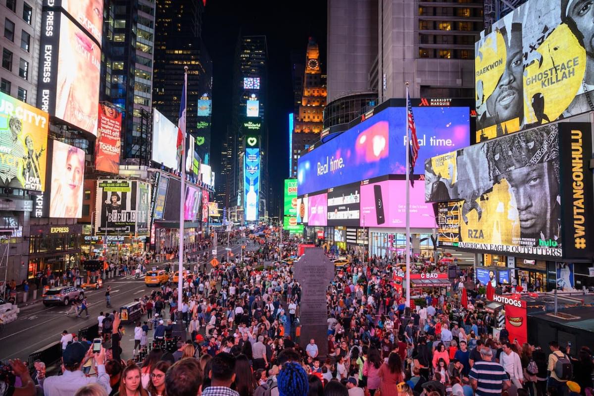 people in times square at night time 1