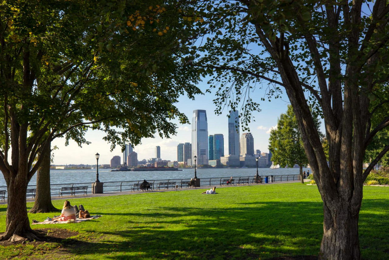 people relaxing battery park new york