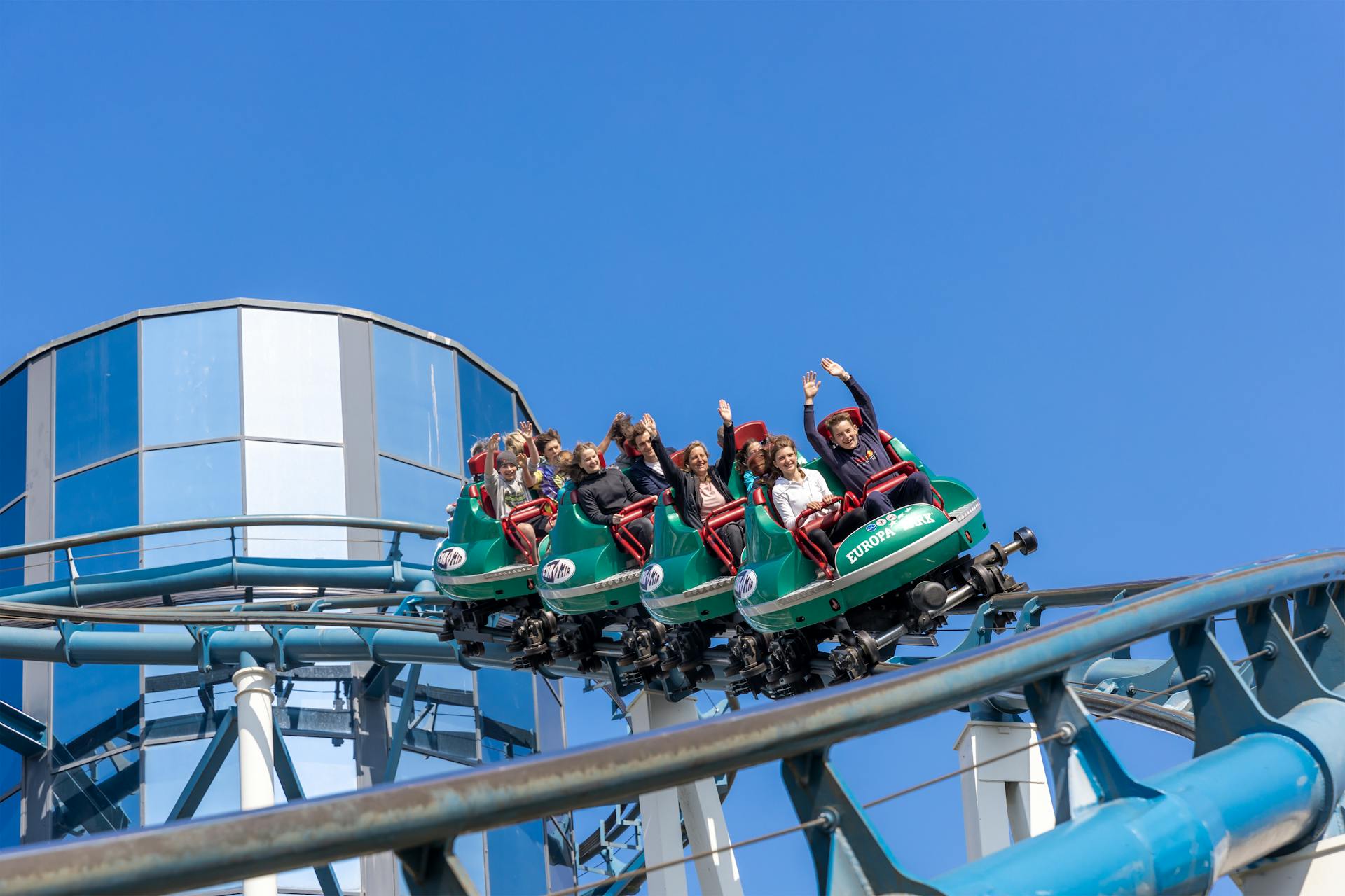 people riding on a roller coaster