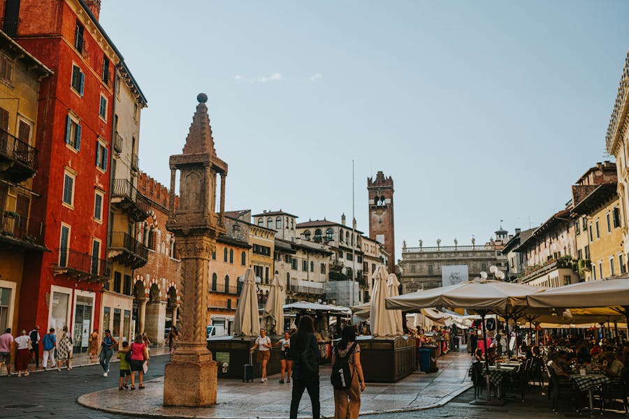 people walking in piazza delle erbe