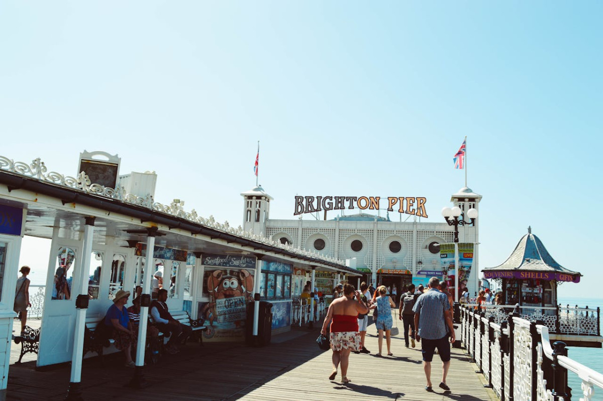 people walking near brighton pier