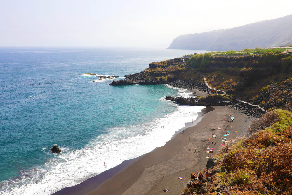 playa de el bollullo black volcanic sand beach