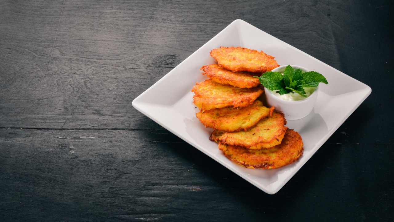 potato cakes with sour cream potato pancakes ukrainian cuisine old wooden background free space text top view