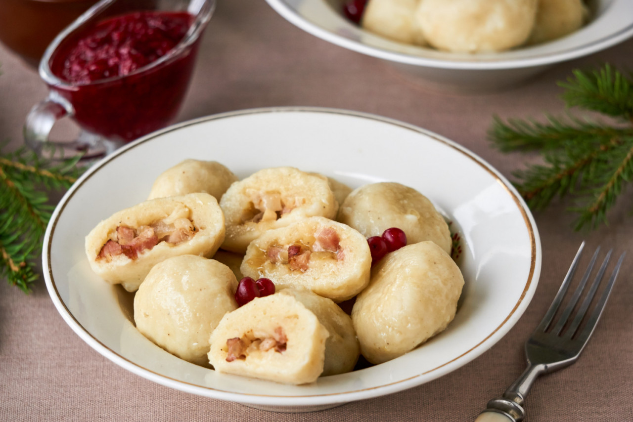 potato dumplings with fried bacon onions lingonberry sauce