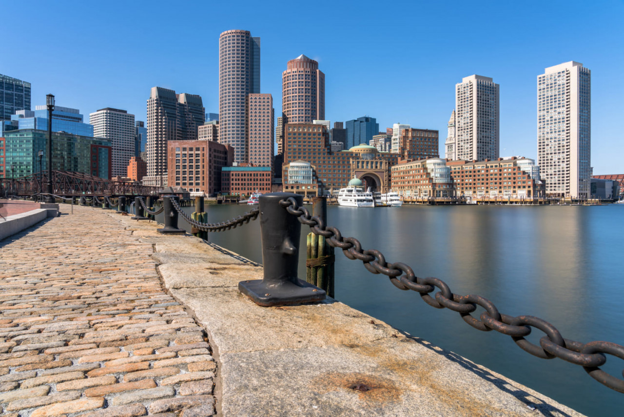 scene boston skyline from fan pier afternoon with smooth water river