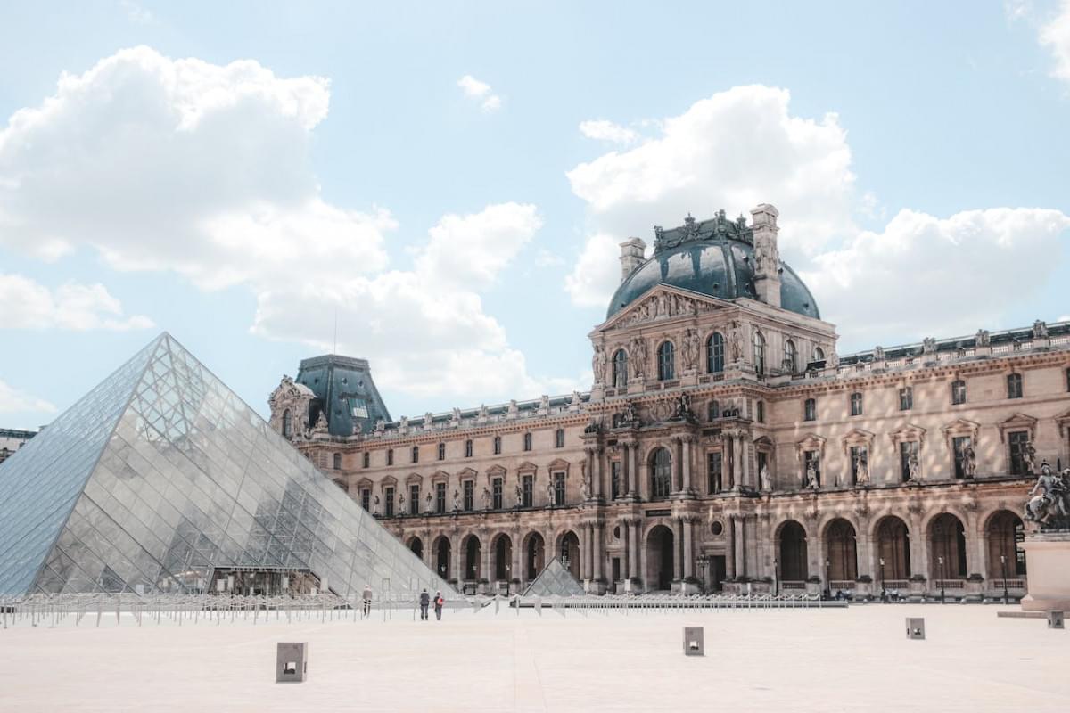 scenery of landmark glass pyramid on louvre museum square