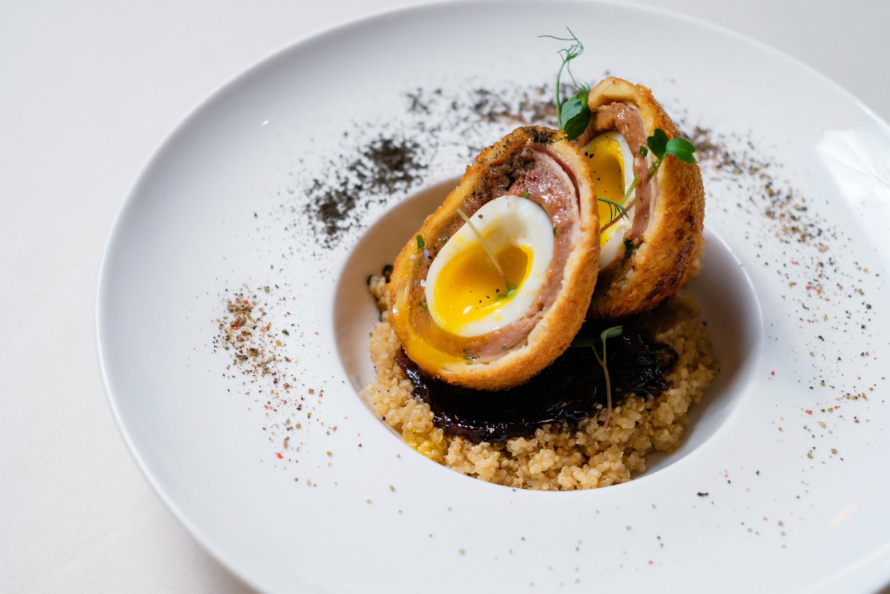 scottish egg white plate decorated with herbs