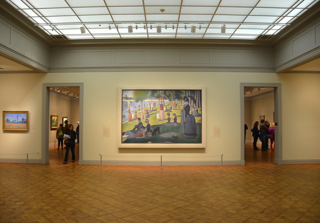 Interno delle gallerie dell'Art Institute con opere d'arte impressionista.