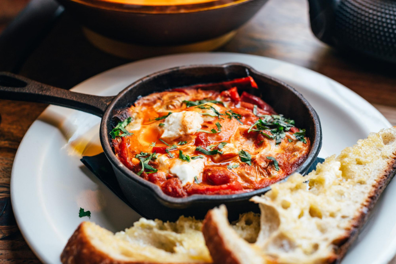 shakshuka iron pan served with bread