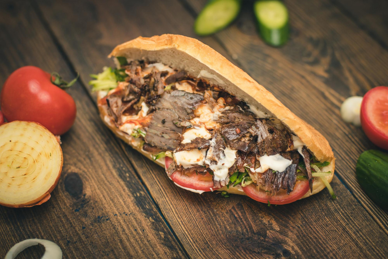 shawarma doner with yogurt tomatoes herbs bun