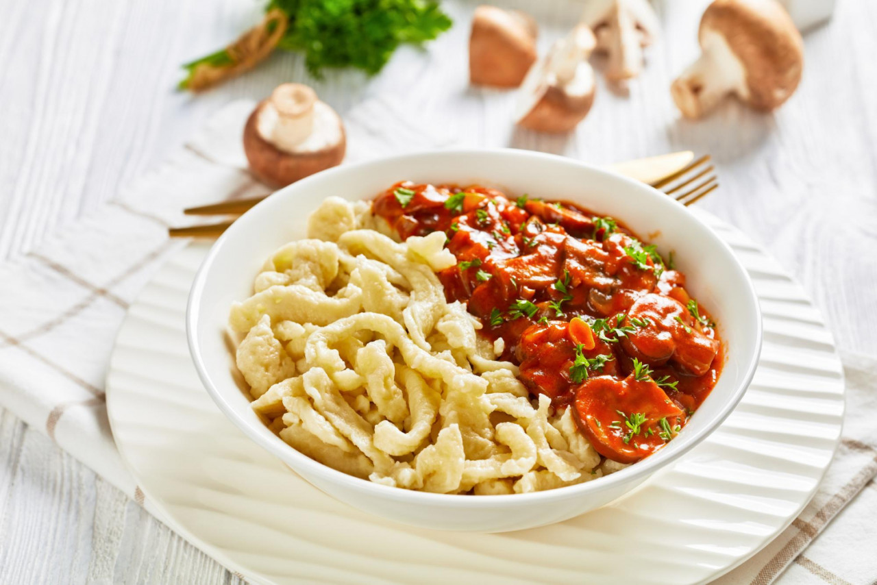 spaetzle with mushroom gravy white bowl