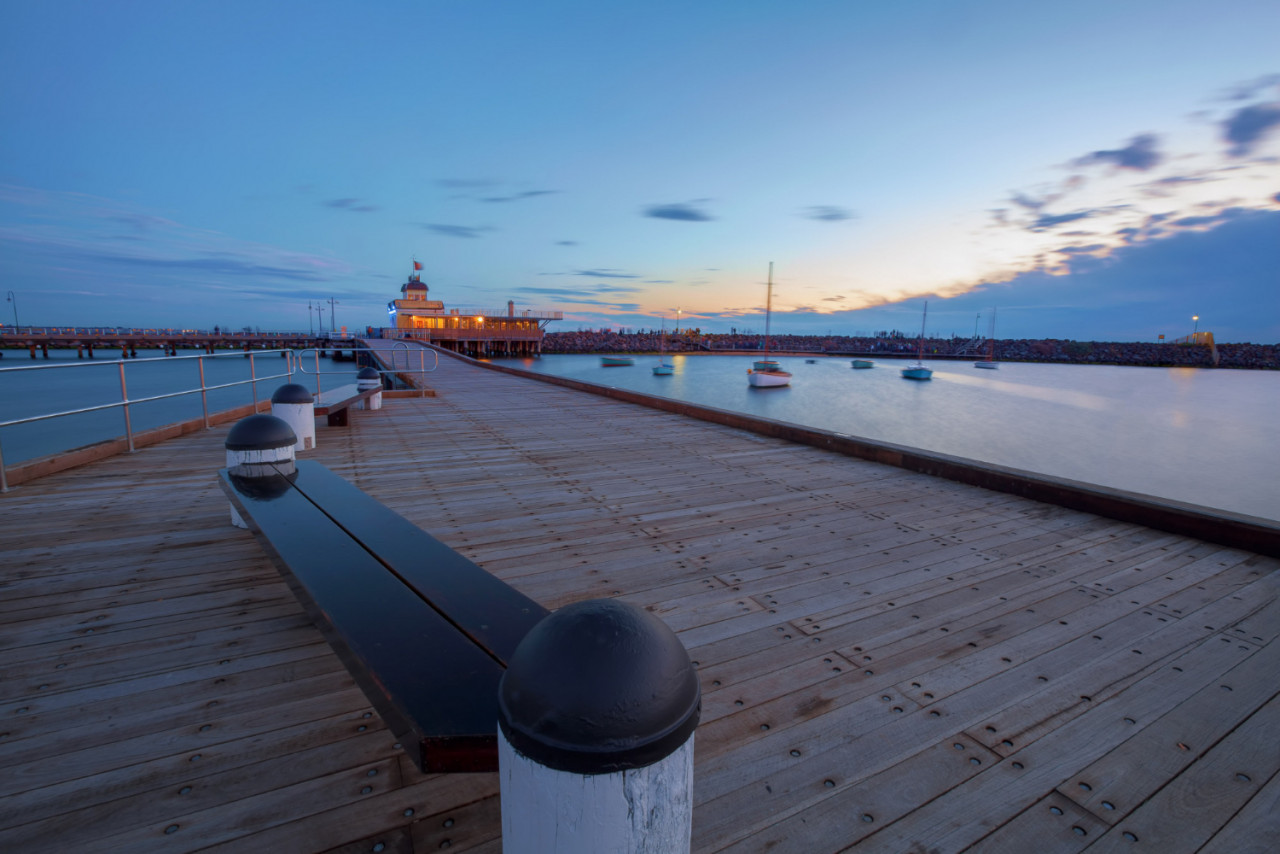 st kilda pier at dusk with boats in the harbour